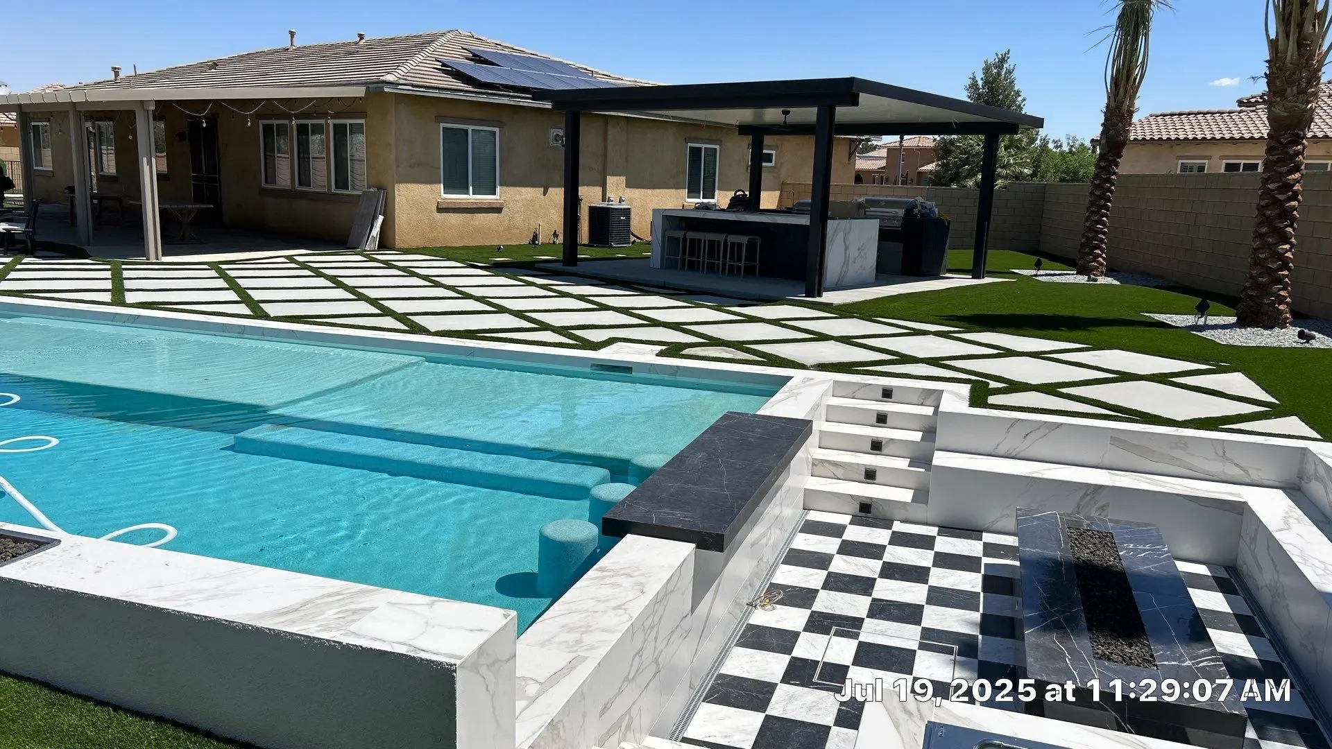 Residential pool remodel with hardscape and turf